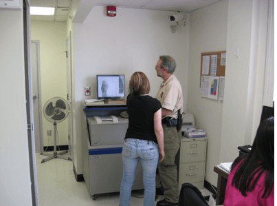 Adult Probation Officer Rick Carr Processes Fingerprints